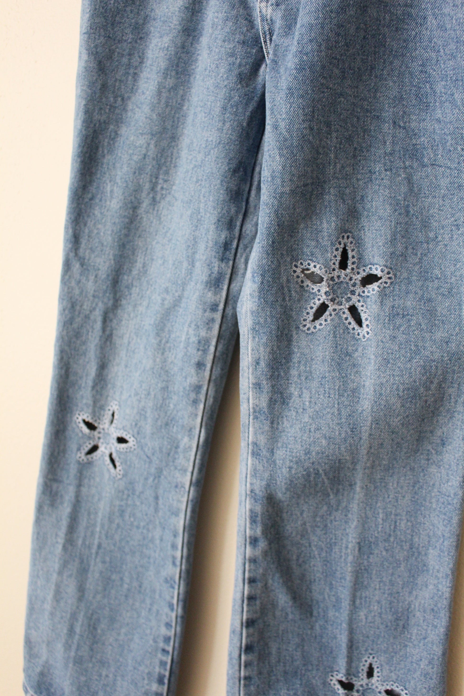 embroidered floral cut out in jeans 