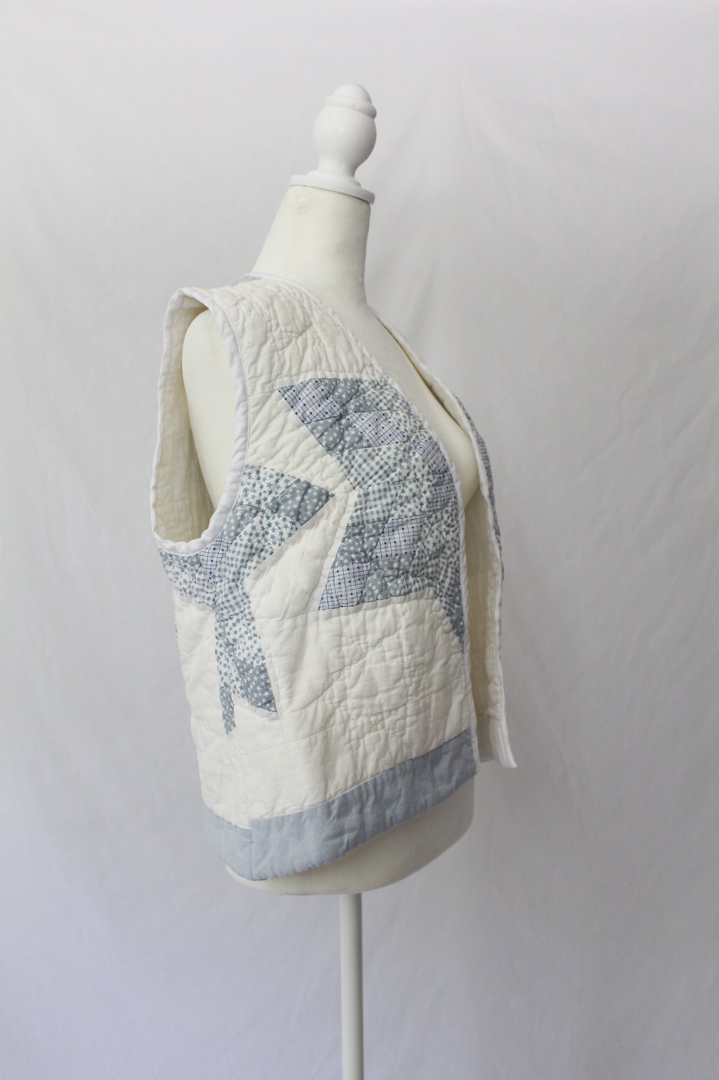 side of blue and white upcycled handmade quilt vest