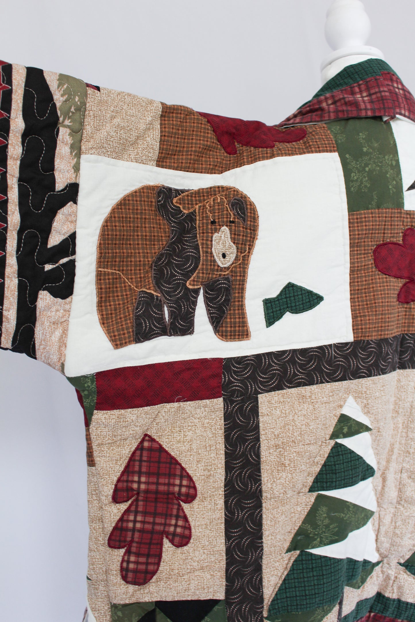bear detail on an upcycled quilt jacket, grizzly bear jacket, brown bear jacket