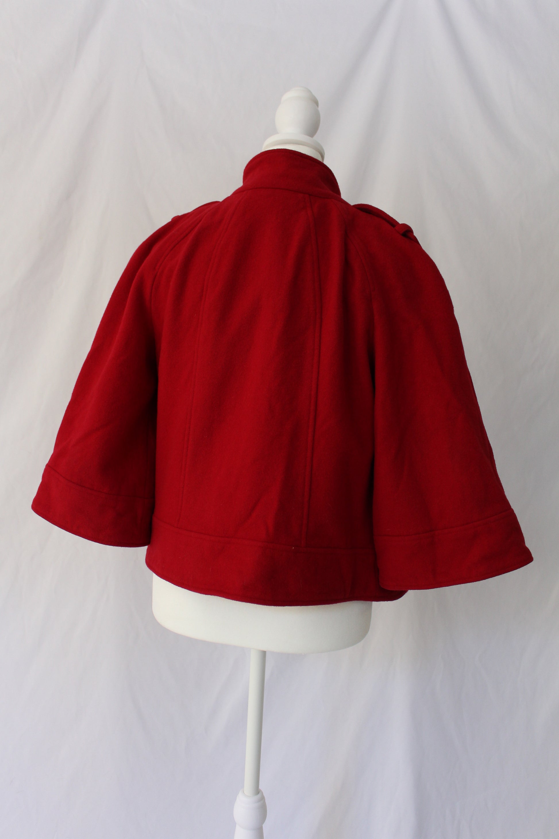 red coat with angled zipper, secondhand red coat with short sleeves