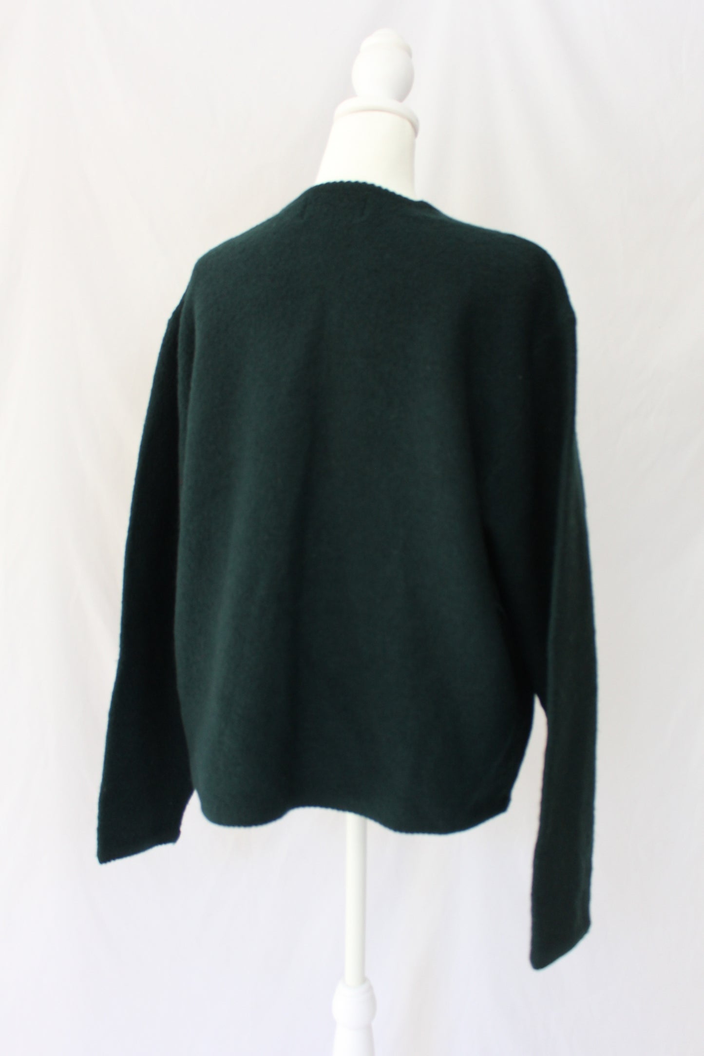 back of 100% wool cardigan, green sweater