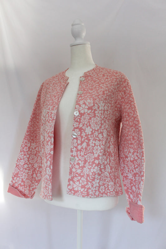 pink and white floral quilted jacket with doily 